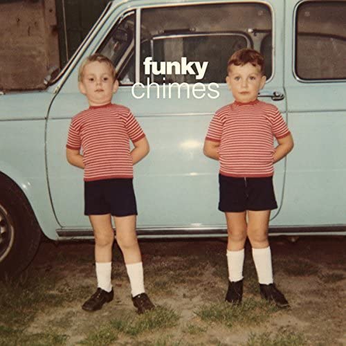 Vinyl record cover with two young boys standing in front of a car.