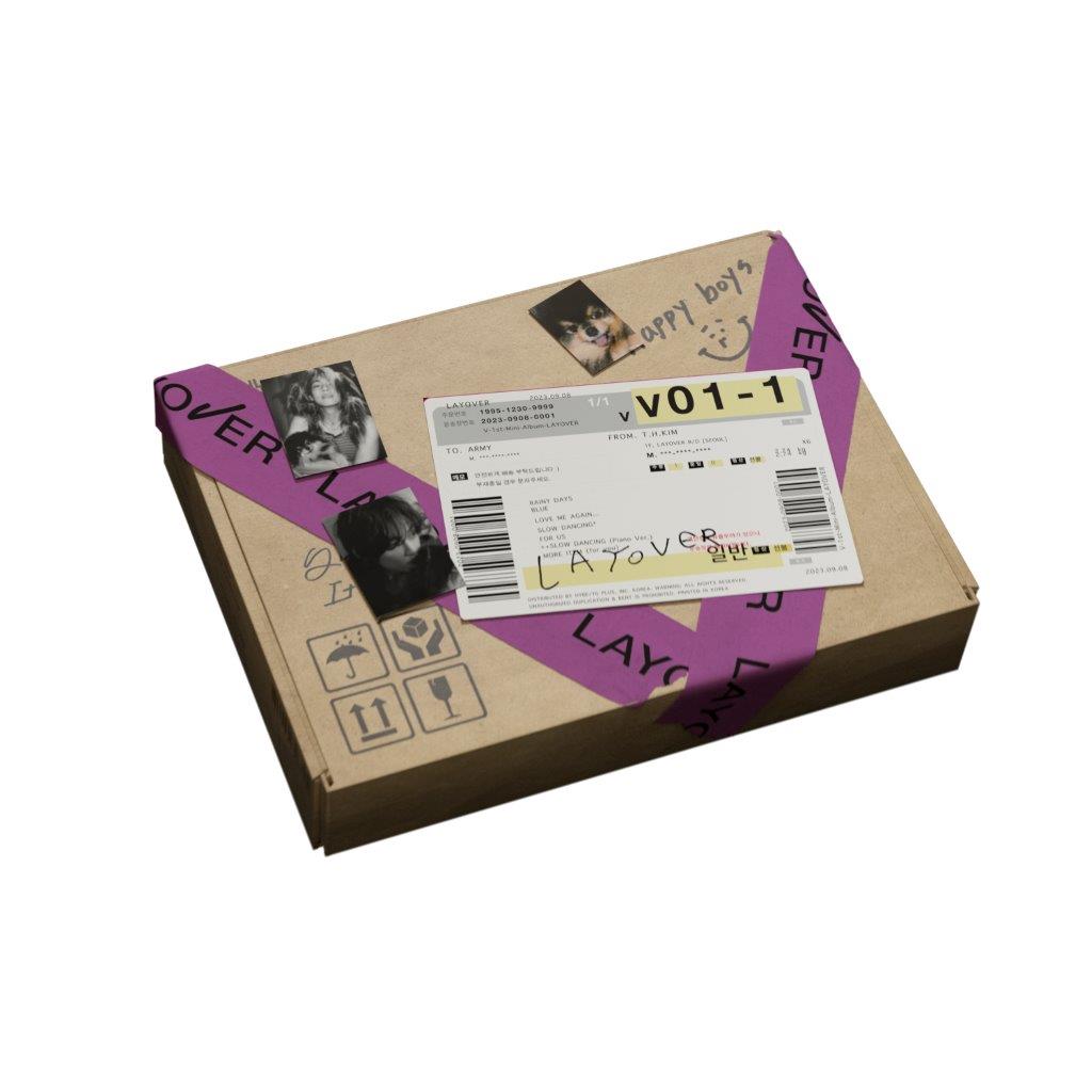 "Brown cardboard box with purple tape and a barcode sticker on top."