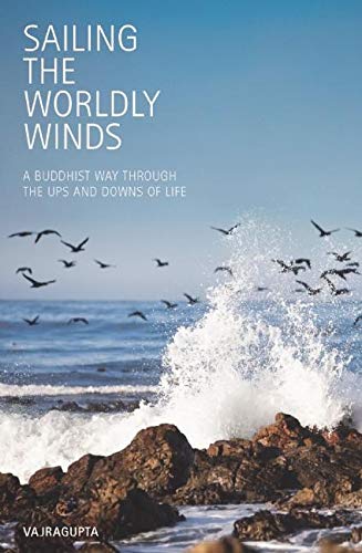A book with a serene cover featuring a sailboat on calm waters at sunset.