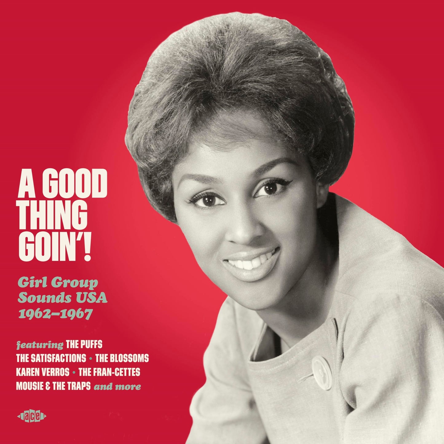 Red album cover featuring a smiling woman with voluminous hair.