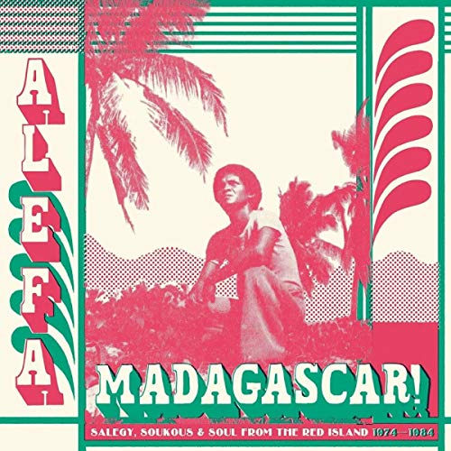 Album cover: man amongst palm trees, bold red and green typography.