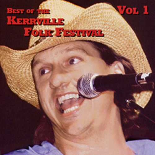 A man in a straw cowboy hat singing into a microphone on stage.