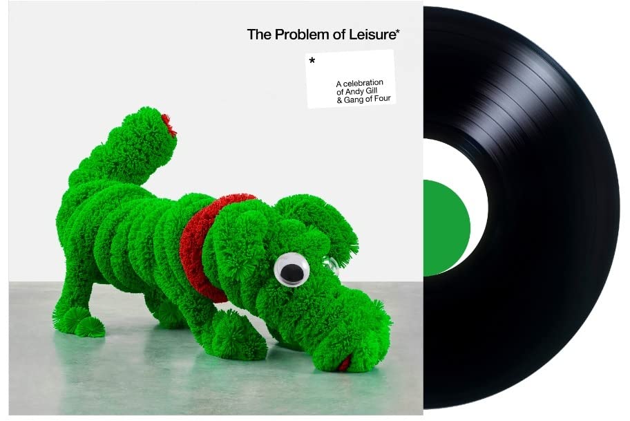 Vinyl record with album art featuring a green caterpillar-dog sculpture.