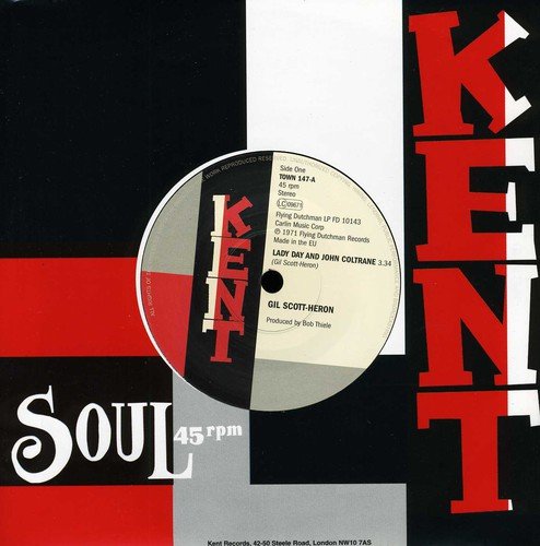 Vinyl record label with text listing artists, song titles, and record details.