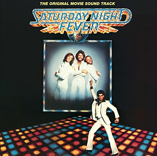 John Travolta dancing on a light-up floor with the Bee Gees pictured above him.