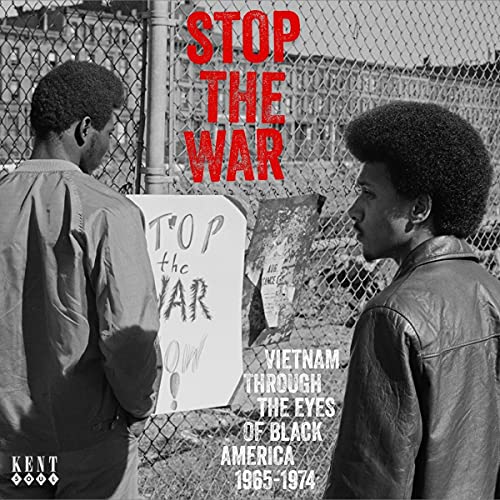 CD cover: Two Black men looking at a protest sign with wire fencing.