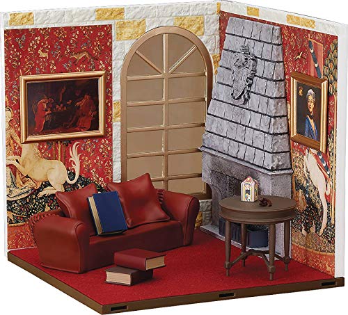 A miniature room diorama featuring a red sofa, fireplace, small table, and tapestry walls.
