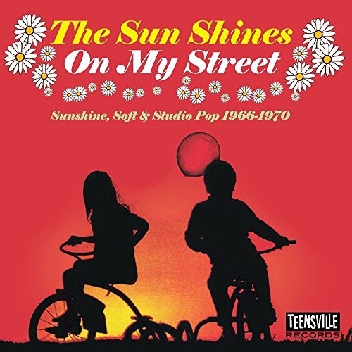 CD cover with silhouetted children on bicycles against a sunset.