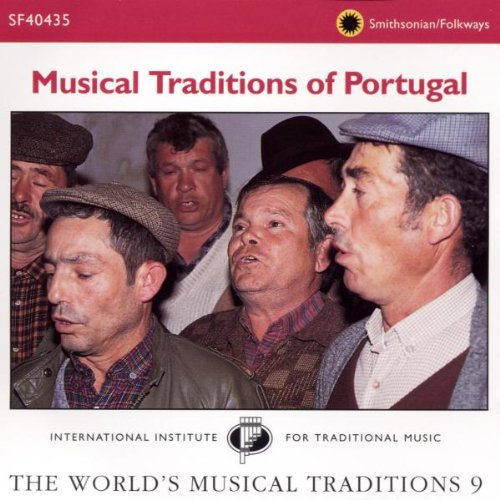 CD cover showing a group of men in flat caps singing together.