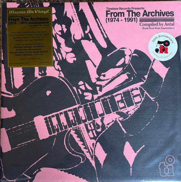 Vinyl record cover: “From The Archives (1974-1991)” with guitar graphic.