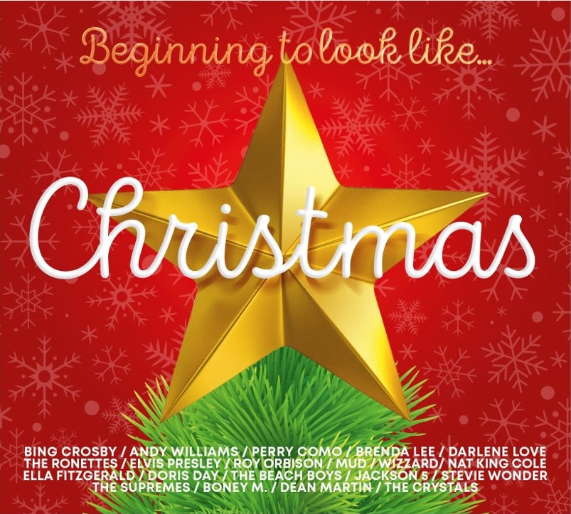 CD cover with a gold star over green branches and red snowflakes.