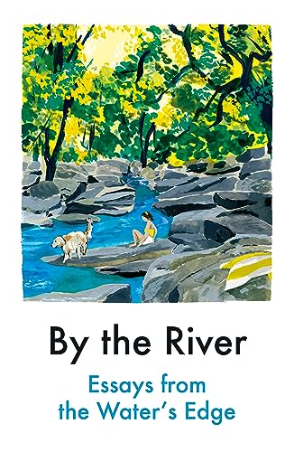 A person and a dog sit by a blue river surrounded by rocks and trees.
