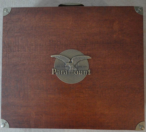 Wooden box with a silver eagle emblem and “Paramount” text.