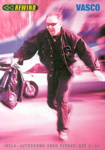 Vasco Rossi on DVD cover, running with a bag, wearing sunglasses.