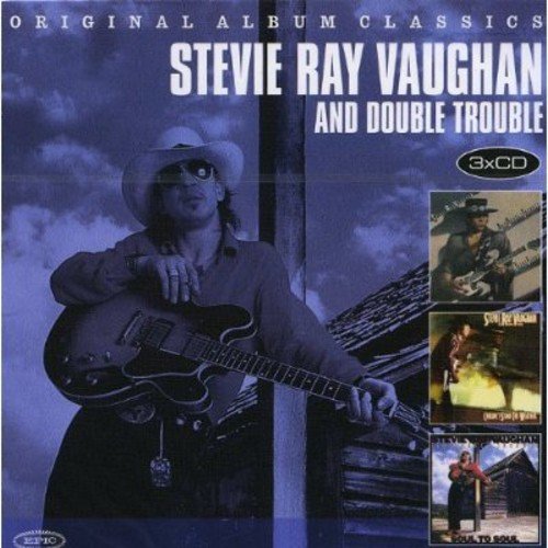 Stevie Ray Vaughan album cover featuring him with a guitar and three inset album images.