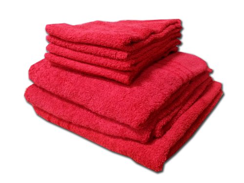 Stack of bright red, fluffy towels against a white background.