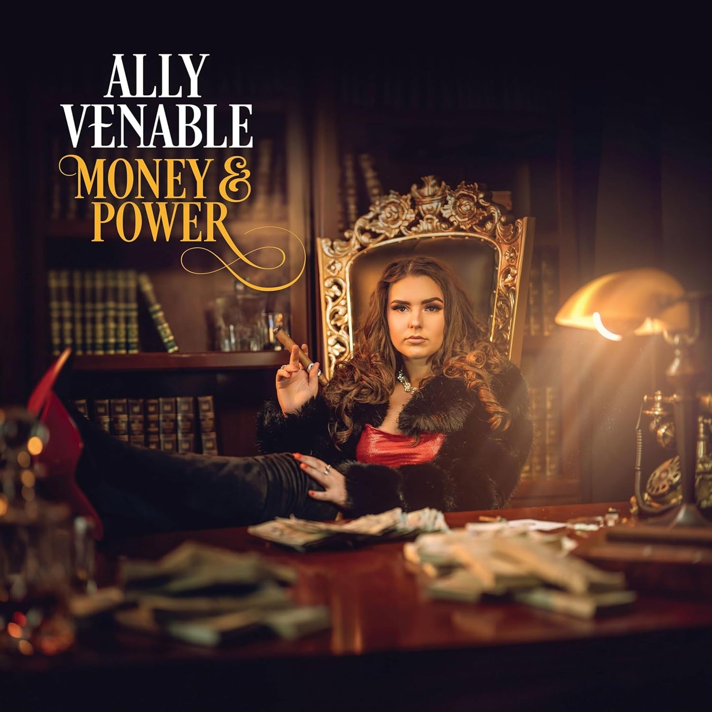Ally Venable sits in a chair with feet on a desk covered in cash.