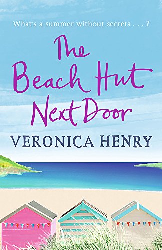 Book cover: “The Beach Hut Next Door” with beach huts and ocean.