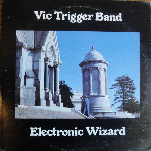 Vinyl album cover: "Electronic Wizard" by Vic Trigger Band, featuring a mausoleum.