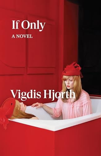 A woman in a red hat sits in a white bathtub against red walls.