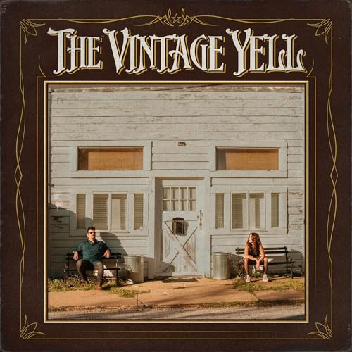 Vinyl album cover featuring a weathered building facade and two seated people.