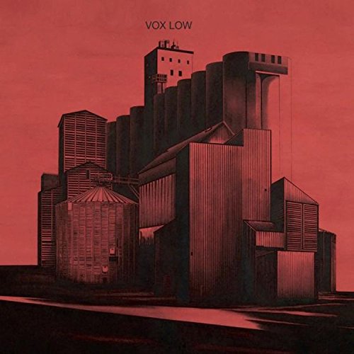 Red-toned album cover featuring an industrial landscape with silos and buildings, titled "Vox Low".