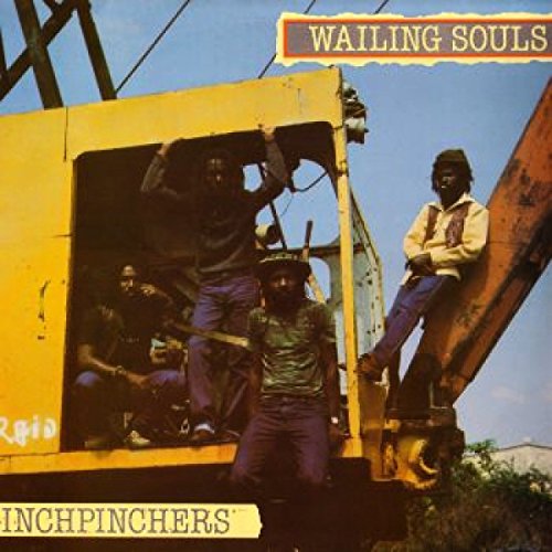 The vinyl album cover features four men on a yellow construction vehicle outdoors.