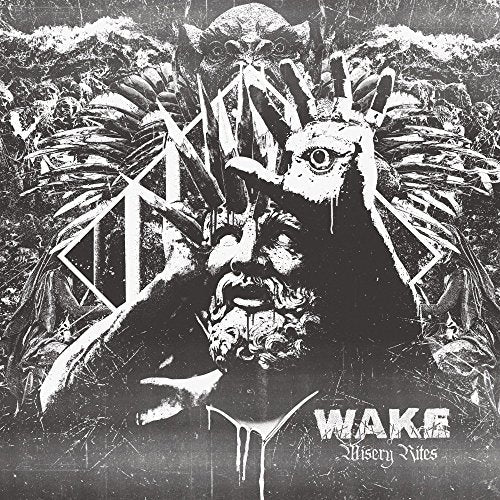 Black and white album cover with distorted faces and geometric shapes.