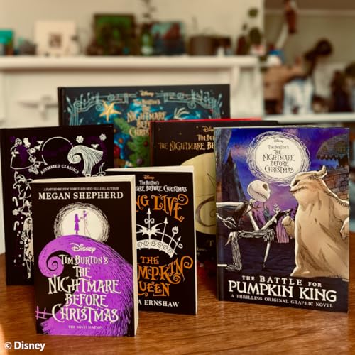 Stack of "The Nightmare Before Christmas" books on a wooden surface.