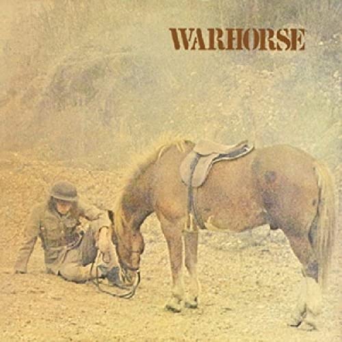 Album cover: person with a horse in a dusty landscape.