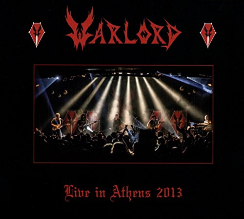 Warlord album cover: band performing on stage with bright lights.