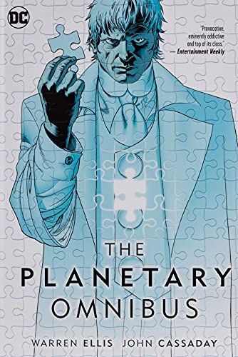 Comic book cover: man holding puzzle piece, blue tones, "The Planetary Omnibus".