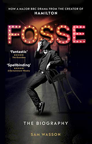 Book cover showing a man in a hat and suit posing with a chair.