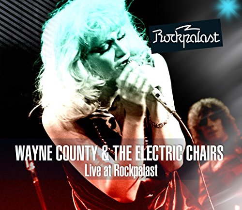 CD cover with a musician singing into a microphone, another musician in the background.