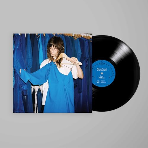 Vinyl record with album cover featuring a woman in blue clothing.