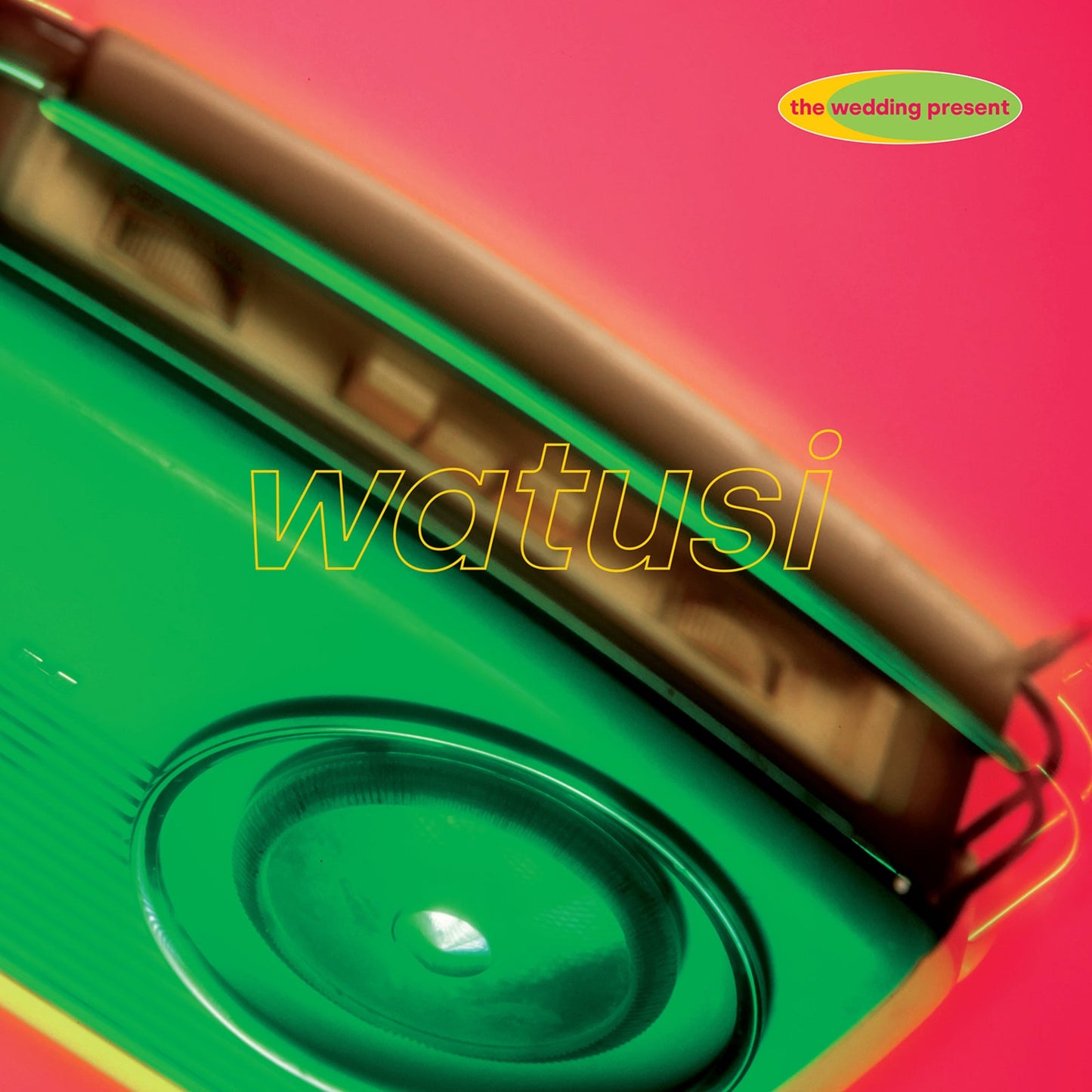 Album cover showing a green vintage radio against a bright pink background.