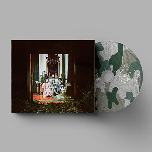 CD case and disc for Wednesday’s “Rat Saw God,” featuring a family portrait.