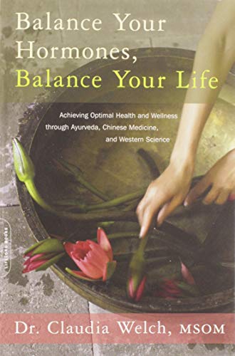 Book cover with hands near water and lotus flowers.