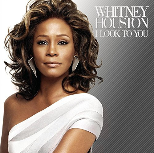 Whitney Houston wearing a white dress on the cover of her album I Look To You.
