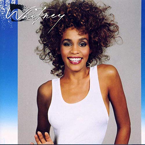 Whitney Houston album cover featuring a smiling portrait of the singer.