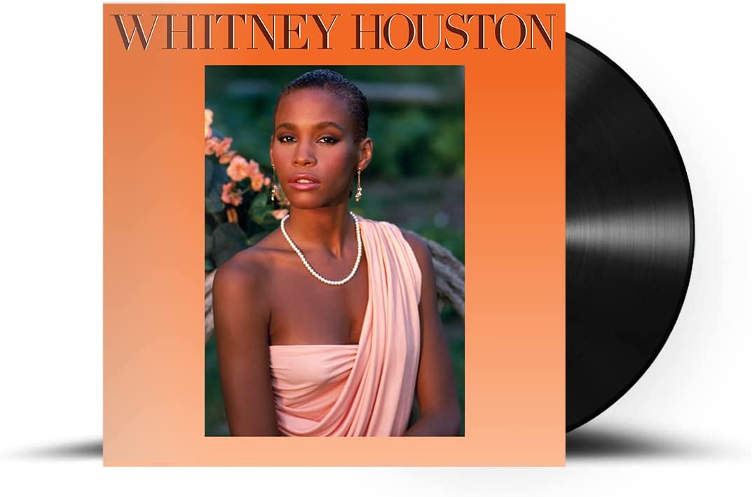 Whitney Houston album cover with portrait and black vinyl record.