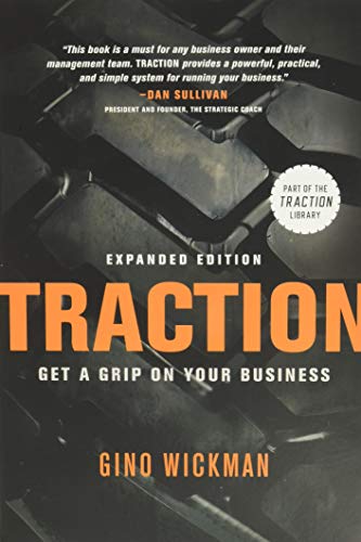 Book cover for Traction by Gino Wickman featuring a dark tire tread background.
