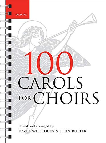 Spiral-bound choral music book with angel illustration and red title bar.