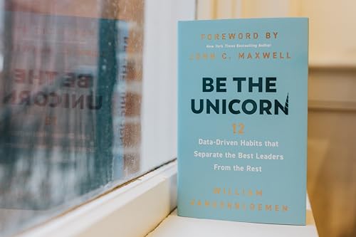 Blue book cover titled “Be the Unicorn” with white and orange text.