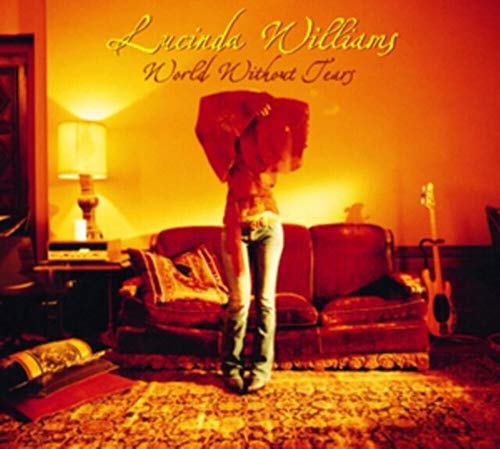 Lucinda Williams album cover: woman with umbrella in a warm room.
