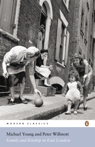 Black and white photo of women and a child on a London street.