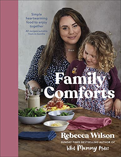 Cookbook cover featuring a woman and child with food on a table.