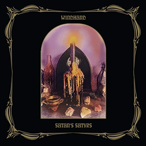 Record cover featuring ornate gold frame, candles, and a dark, surreal scene.