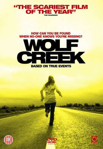 A person runs down a desolate road under a yellow sky on a DVD cover.