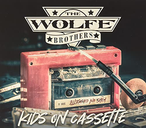 Red cassette tape with "Kids On Cassette" text and Wolfe Brothers logo.